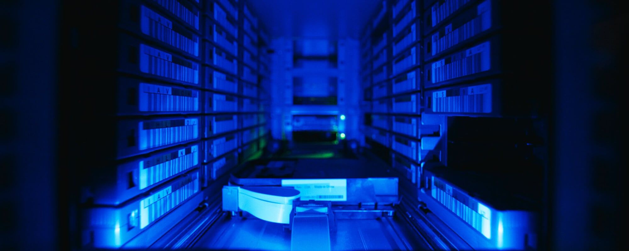 An extreme closeup of an LTO tape in a tape robot