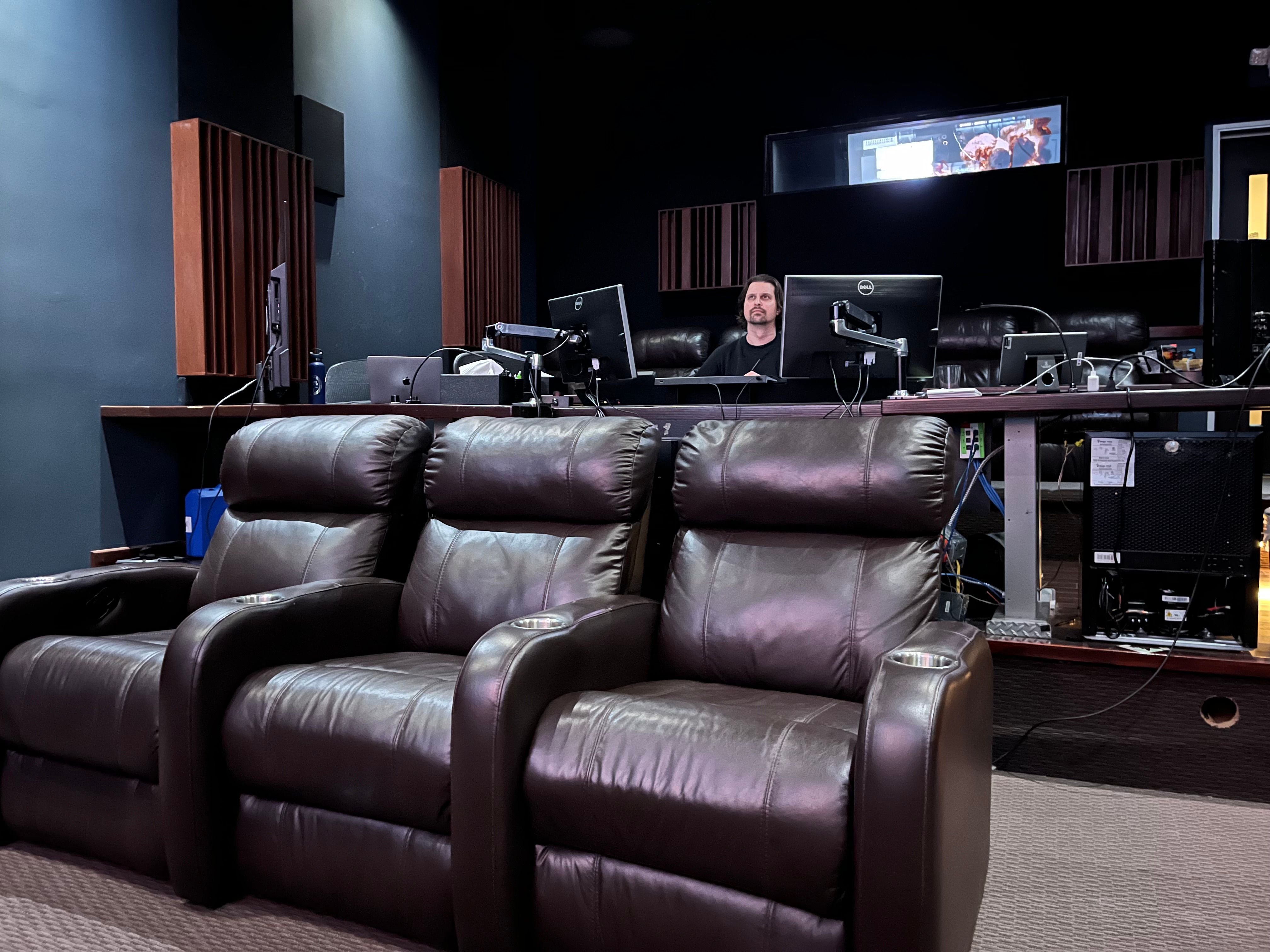 Theater 2 seating facing the 16 by 9 foot screen at Light Iron